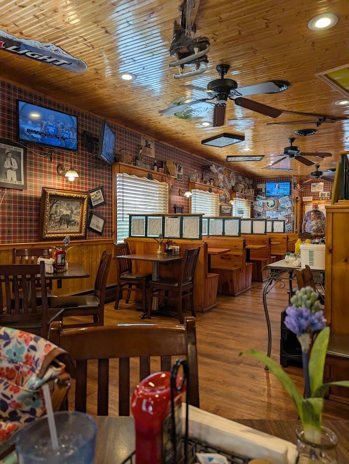 Bar area with casual seating and warm lighting.